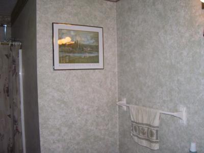 Master bathroom walls decorated with sponge painting