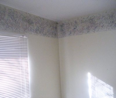 Sometimes a single band of sponged on color is enough to add interest to a room