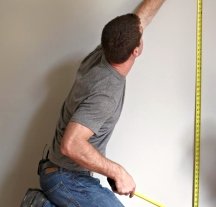 Measure the height of the walls to lay out horizontal wall stripes